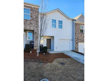 Charming townhouse with a one-car garage and a well-maintained front yard at 3568 Eagle Sw Ct, Atlanta, GA 30331