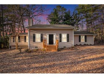 Charming one-story home with neutral siding, black shutters, and a welcoming front porch at 170 Charlotte Blvd, Stockbridge, GA 30281