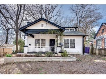 Charming renovated bungalow with black trim, white siding and front porch at 934 Hope Dr, Atlanta, GA 30310