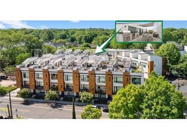 Modern townhome exterior showcasing a rooftop deck with outdoor kitchen and dining, surrounded by lush greenery at 1307 Glenwood Se Ave, Atlanta, GA 30316