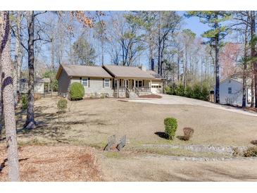 Charming single-story home featuring well-maintained landscaping and a cozy front porch at 2222 Ivy Crest Dr, Buford, GA 30519