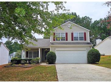 Charming two-story home with a well-maintained front yard and attached two car garage at 1109 Willow Crest Way, Austell, GA 30168