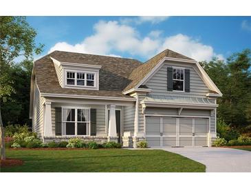 Charming two-story home showcasing meticulous landscaping and inviting curb appeal in a peaceful neighborhood at 53 Colonial Ter, Villa Rica, GA 30180