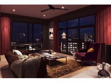 Inviting living room with dark accents, floor-to-ceiling windows, and stylish furnishings at 567 Ponce De Leon Ne Ave # 502, Atlanta, GA 30308