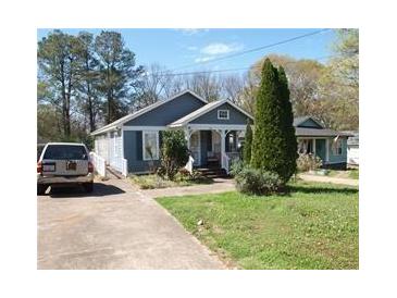 Charming bungalow-style home with well-maintained landscaping and a private driveway at 998 Sparks Sw St, Atlanta, GA 30310