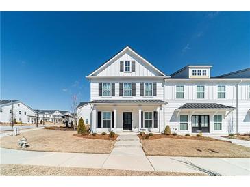 Charming two-story home with black shutters, white siding, and inviting front porch at 1703 Prospect Way, Conyers, GA 30094