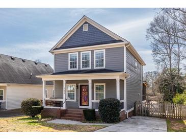 Charming two-story home featuring a covered front porch and well-maintained landscaping, ideal for suburban living at 134 Turman Se Ave, Atlanta, GA 30315