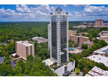 Stunning aerial view showcasing the high-rise condo with its pool and beautiful surrounding landscape at 2828 Peachtree Nw Rd # 903, Atlanta, GA 30305