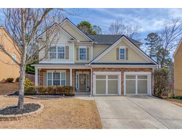 Charming two-story home featuring a three-car garage, stone accents and well-maintained landscaping at 1169 Harvest Brook Dr, Lawrenceville, GA 30043