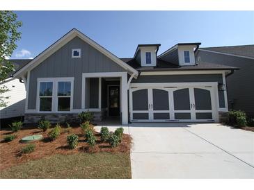 Charming single-Gathering home featuring a two-car garage, and craftsman style front porch at 2040 Ripple Park Bnd, Canton, GA 30114