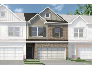 Charming brick and siding townhome with a two-car garage and well-manicured lawn at 208 Bastian Dr # 108, Villa Rica, GA 30180
