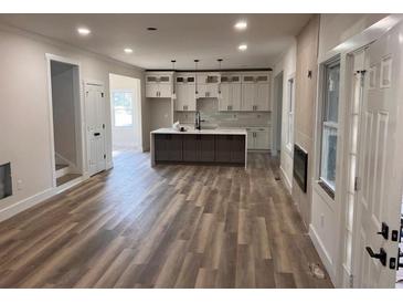 Spacious open-concept kitchen featuring a center island, stainless appliances, and ample counter space at 1400 Bouldercrest Rd, Atlanta, GA 30316