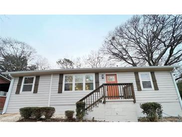 Charming single story home featuring wood accents, neutral siding and a brick foundation at 2215 Gordon Se Cir, Smyrna, GA 30080