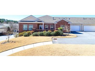 Charming brick home with a well-maintained lawn and inviting curb appeal at 223 Villa Park Cir, Stone Mountain, GA 30087