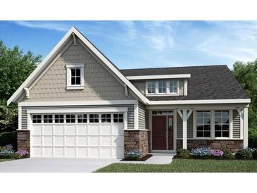 Charming single-Gathering home featuring a two-car garage, stone accents, and a covered front porch at 33 Dartmoor Cir, Dallas, GA 30157