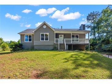 Charming home with a well-manicured lawn and inviting front porch at 28 Fawn Ct, Sharpsburg, GA 30277