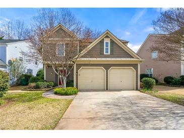 Charming two-story home with a two-car garage and well-maintained landscaping at 2829 Priestcliff Se Dr, Smyrna, GA 30080