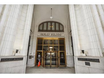 Ornate entrance to the Healey Building featuring marble columns and gold-trimmed doors at 57 Forsyth Nw St # 4H, Atlanta, GA 30303