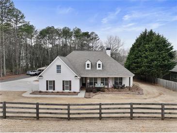 Charming single Gathering home featuring a well-maintained yard and an inviting front porch at 1605 Dr Bramblett Rd, Cumming, GA 30028