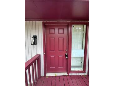Inviting front door with sidelight window and traditional design at 4829 Woodhurst Way, Stone Mountain, GA 30088