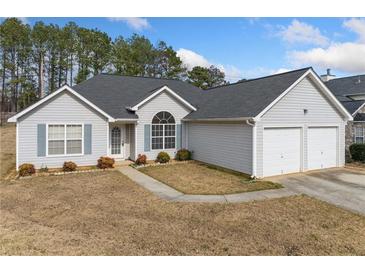 Charming single-story home with a two-car garage and well-maintained front yard at 4768 Score Ct, Snellville, GA 30039