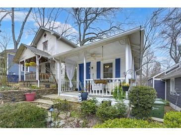 Charming craftsman-style home featuring a welcoming front porch and lush landscaping at 818 Virgil Ne St, Atlanta, GA 30307