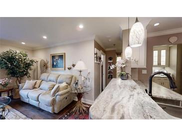 Comfortable living room features a plush sofa, stylish decor, and marble countertops at 300 Johnson Ferry Ne Rd # A403, Atlanta, GA 30328