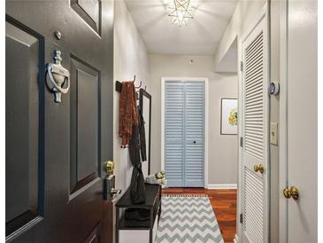 Welcoming entryway featuring a coat rack, bench, and a stylish chevron patterned rug at 1280 W Peachtree Street Nw, Unit #3414, Atlanta, GA 30309