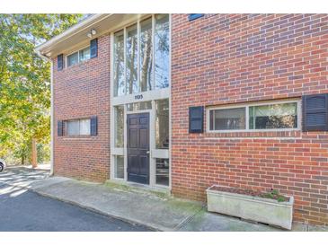 Charming red brick multi-Gathering home with black shutters and ample natural light through large windows at 1135 Clairemont Ave # B, Decatur, GA 30030
