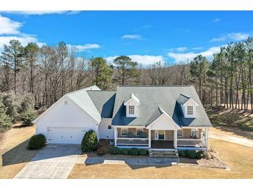 Charming single-Gathering home features a covered front porch, dormer windows and an attached two-car garage at , Auburn, GA 30011