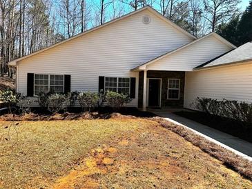Charming home with a well-manicured front yard and a welcoming entrance at 359 Cannongate Rd, Sharpsburg, GA 30277