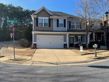 Charming two-story home with a two-car garage, a well-manicured lawn, and a welcoming front porch at 801 Rutledge Ct, Woodstock, GA 30188