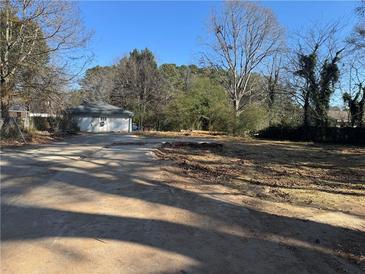 Cleared lot with old driveway and detached garage provides a potential building opportunity at 4955 Campbellton Sw Rd, Atlanta, GA 30331