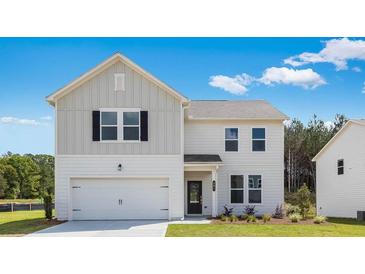 Charming two-story home with white siding, black shutters, and a well-manicured front lawn at 201 Groveton Ct, Euharlee, GA 30145