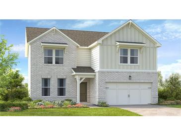 Charming two-story home featuring a brick and siding facade, complemented by a well-manicured front yard at 201 Groveton Ct, Euharlee, GA 30145
