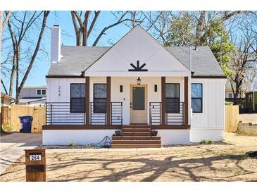 Charming renovated home with a crisp white exterior, black accents, and inviting front porch at 264 Haas Ave, Atlanta, GA 30316