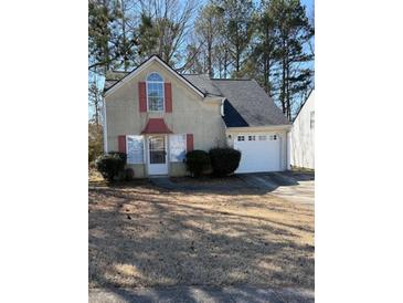 Charming home featuring a two-car garage and well-maintained yard in a quiet, established neighborhood at 3133 West Point Cir, Douglasville, GA 30134