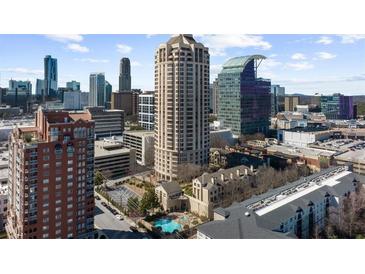 Stunning aerial view of a cityscape featuring luxury residences, modern buildings, and a beautiful pool at 3475 Oak Valley Ne Rd # 410, Atlanta, GA 30326