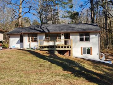 Charming single-story home with a welcoming front porch and freshly painted exterior at 1368 Harbin Sw Rd, Atlanta, GA 30311