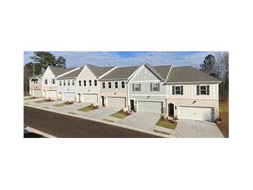 Charming new townhomes with attached garages and a landscaped lawn at 4541 Moray Dr, Mableton, GA 30126
