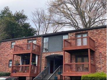 Charming brick building with multiple levels and private balconies, offering a cozy and inviting living space at 323 Ne 8Th Ne St, Atlanta, GA 30309