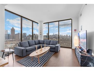 Bright living room with floor-to-ceiling windows and a great city view at 270 17Th Nw St # 2601, Atlanta, GA 30363