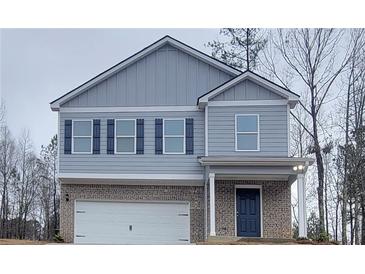 Charming two-story home with gray siding, black shutters, and a welcoming front porch at 425 Camella Cir, Mcdonough, GA 30252