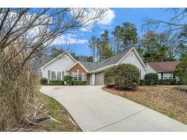 Charming single-story home with a well-manicured lawn and inviting curb appeal at 619 Rivulett Ct, Lawrenceville, GA 30043