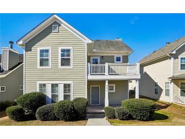 Charming two-story home features a cute balcony, neat front yard, and welcoming curb appeal at 4593 Parkway Cir, Atlanta, GA 30349