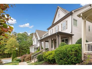 Charming townhome with inviting front porch and manicured landscaping at 2625 Draw Dr, Marietta, GA 30066