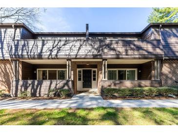 Inviting front entrance featuring a brick facade, covered porch, and well-maintained landscaping at 765 Houston Mill Ne Rd # 7, Atlanta, GA 30329