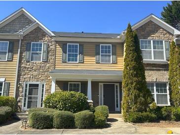 Charming townhome with stone accents, neutral siding, and well-maintained landscaping at 585 Mcwilliams Se Rd # 2602, Atlanta, GA 30315