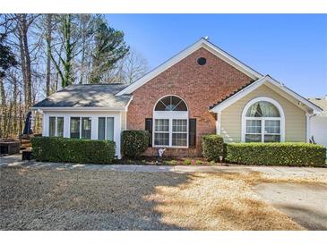 Charming brick home featuring manicured landscaping and a welcoming entrance at 1203 Cascade Park Sw Dr, Atlanta, GA 30331