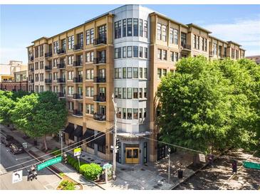 Elegant condo building with well-manicured landscaping and street access at 201 W Ponce De Leon Ave # 315, Decatur, GA 30030